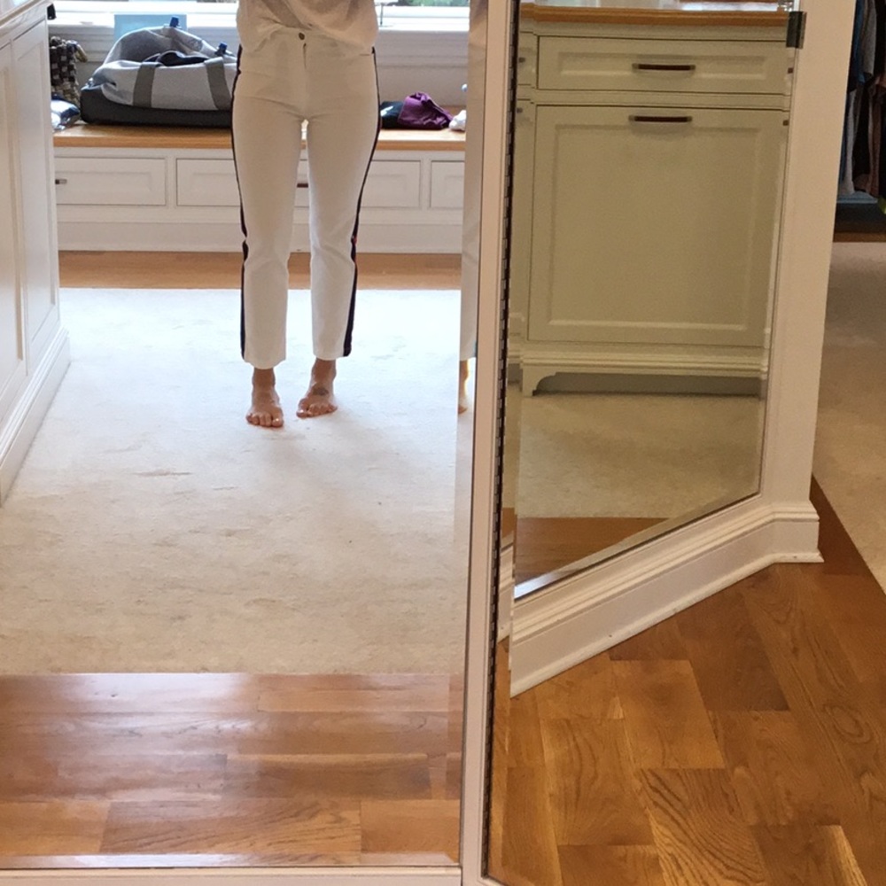 White stretch jean red and blue stripe on side.